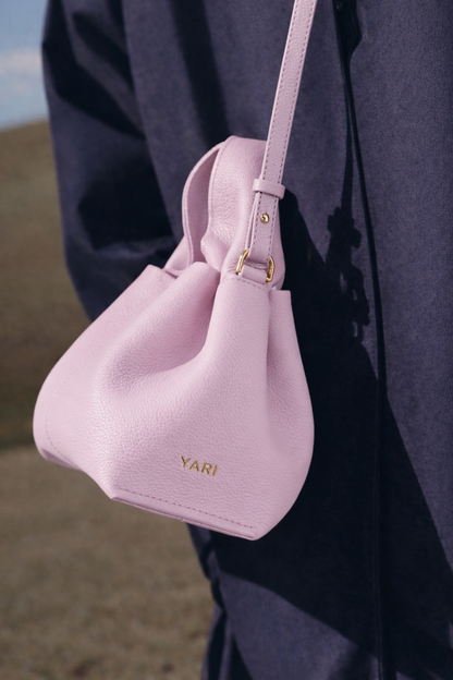 Modern Minimalist Editorial Look Featuring Draped Sage Grey Tailoring with Structured Soft Lilac Leather Crossbody Top Handle Handbag – Elegant Quiet Luxury Womenswear Fashion Style