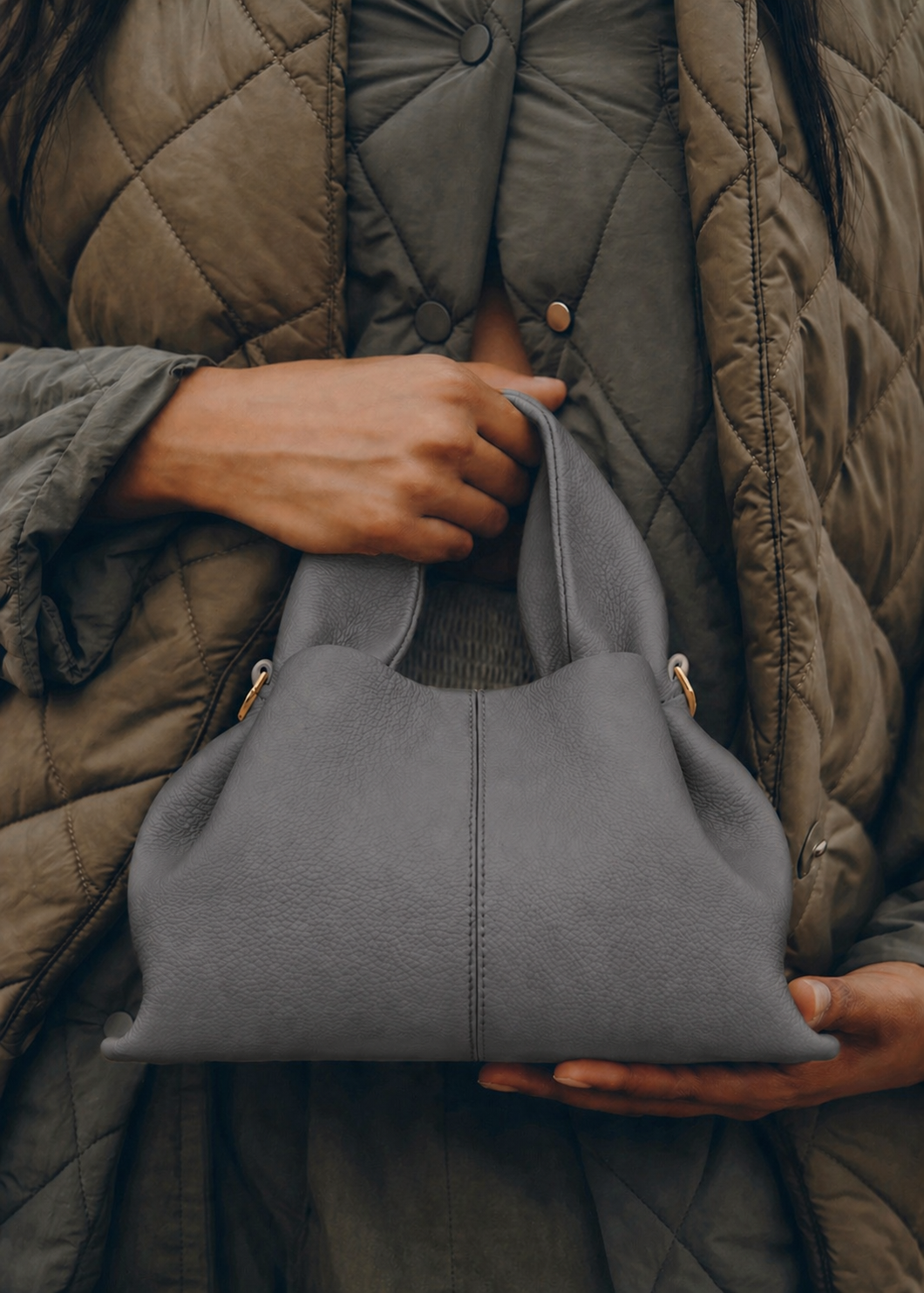 Elegant Minimalist Slate Grey Pebbled Leather Top Handle Handbag with Soft Sculptural Silhouette and Gold Hardware – Modern Quiet Luxury Designer Accessory Product Shot