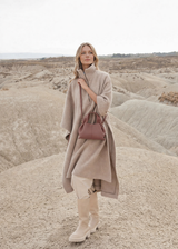 Elegant Minimalist Taupe Wool Cape Outfit with Structured Dusty Rose Leather Crossbody Handbag – Timeless Neutral Luxury Fashion Editorial Look for Autumn/Winter Womenswear