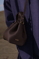 Moody Minimalist Outdoor Look Featuring Monochrome Plum Knit Layering and Tailored Trousers with Structured Espresso Brown Leather Top Handle Handbag – Sophisticated Quiet Luxury Womenswear Editorial Style