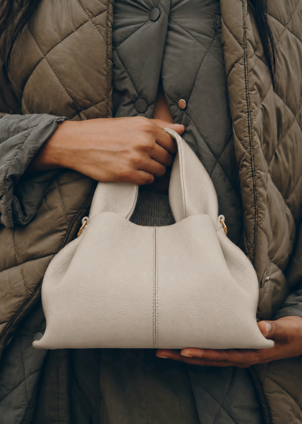 Elegant Winter Minimalist Look Featuring Rich Chocolate Wool Coat and Textured Knit Sleeves with Structured Stone Beige Leather Top Handle Handbag – Timeless Quiet Luxury Womenswear Editorial Style
