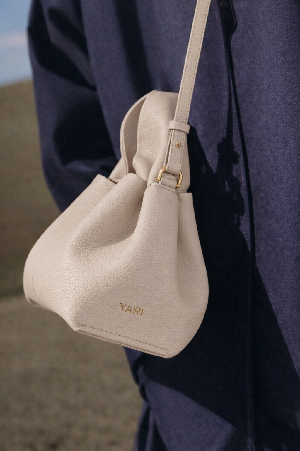 Elegant Winter Minimalist Look Featuring Rich Chocolate Wool Coat and Textured Knit Sleeves with Structured Stone Beige Leather Top Handle Handbag – Timeless Quiet Luxury Womenswear Editorial Style