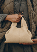 Relaxed Minimalist Coastal Look Featuring Ribbed Oatmeal Knit Cardigan and Soft Neutral Wide-Leg Trousers with Structured Sand Beige Leather Crossbody Handbag – Effortless Quiet Luxury Womenswear Editorial Style