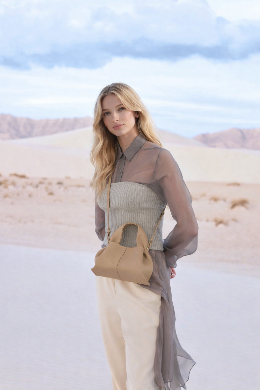 Modern Minimalist Neutral Outfit Featuring Sheer Taupe Button-Up Shirt Layered Over Ribbed Knit Bustier with Flowing Trousers and Structured Sand Beige Leather Top Handle Handbag – Elegant Contemporary Womenswear Editorial Look