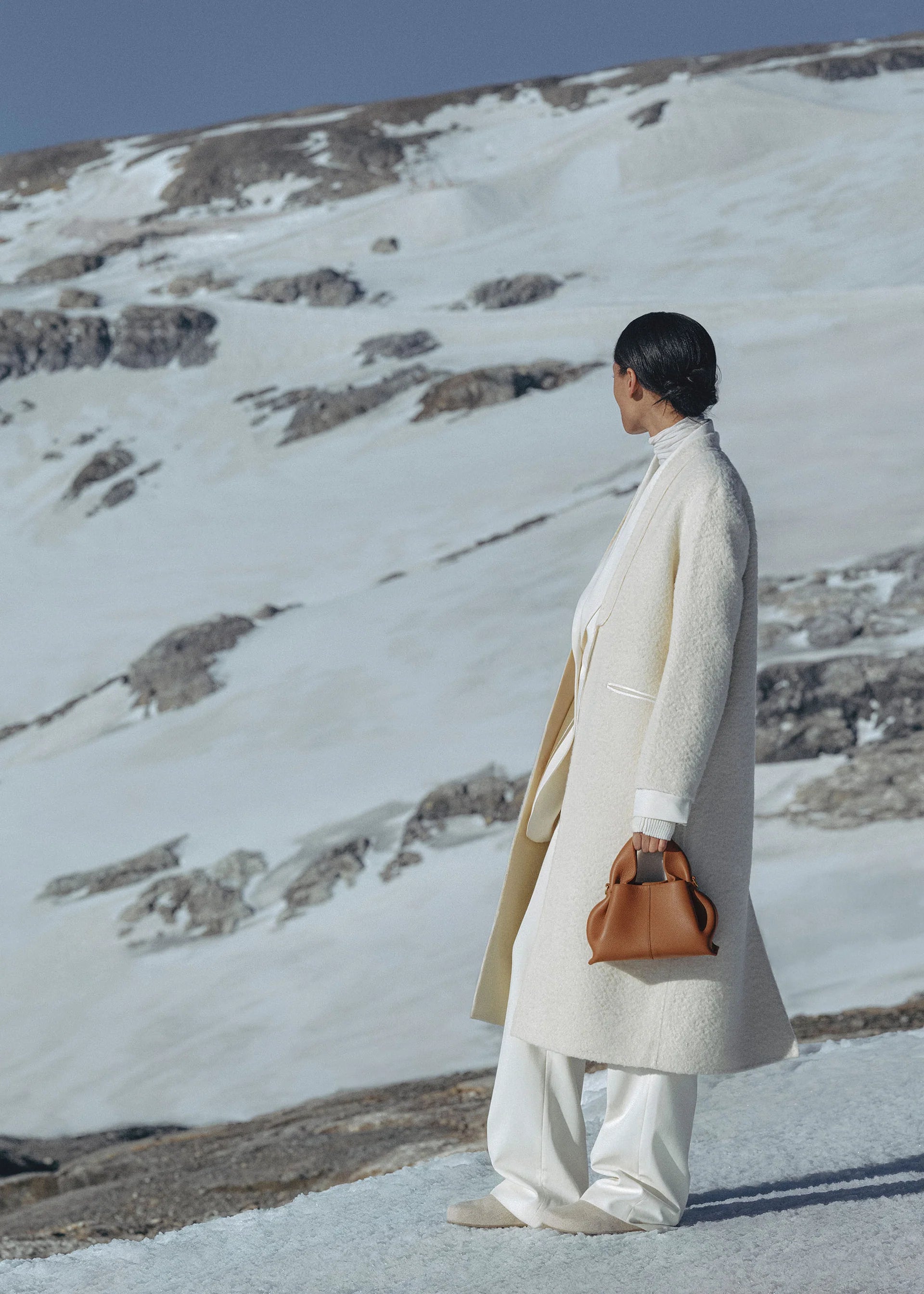 Elegant Winter Minimalist Look Featuring Ivory Textured Wool Coat and Cream Tailored Trousers with Structured Cognac Leather Top Handle Handbag – Timeless Quiet Luxury Womenswear Editorial Style