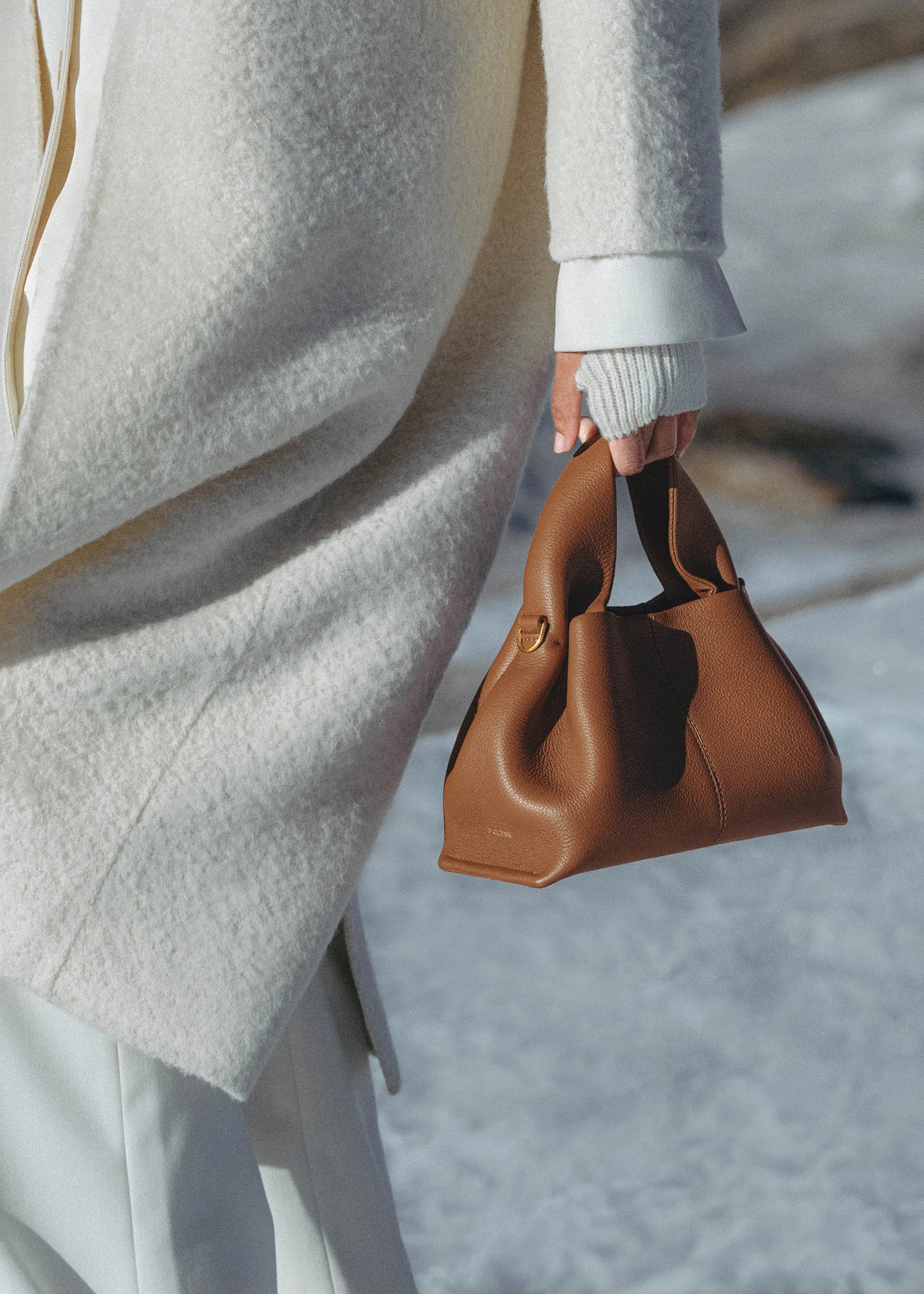Elegant Winter Minimalist Look Featuring Ivory Textured Wool Coat and Cream Tailored Trousers with Structured Cognac Leather Top Handle Handbag – Timeless Quiet Luxury Womenswear Editorial Style