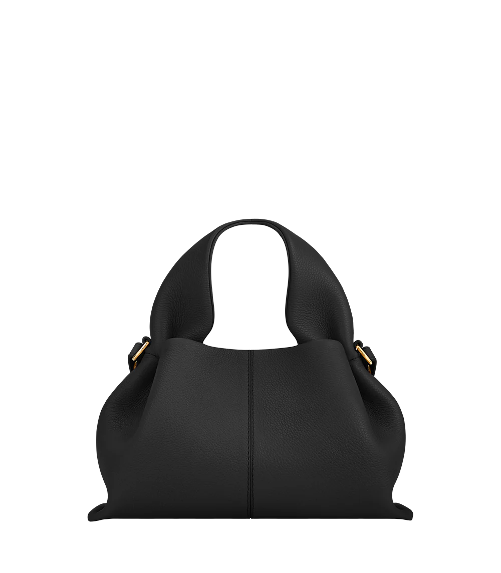 Sophisticated Minimalist Trench Coat Ensemble Featuring Oversized Stone Beige Outerwear and Layered Neutral Tailoring with Structured Black Leather Top Handle Handbag – Modern Quiet Luxury Womenswear Editorial Look