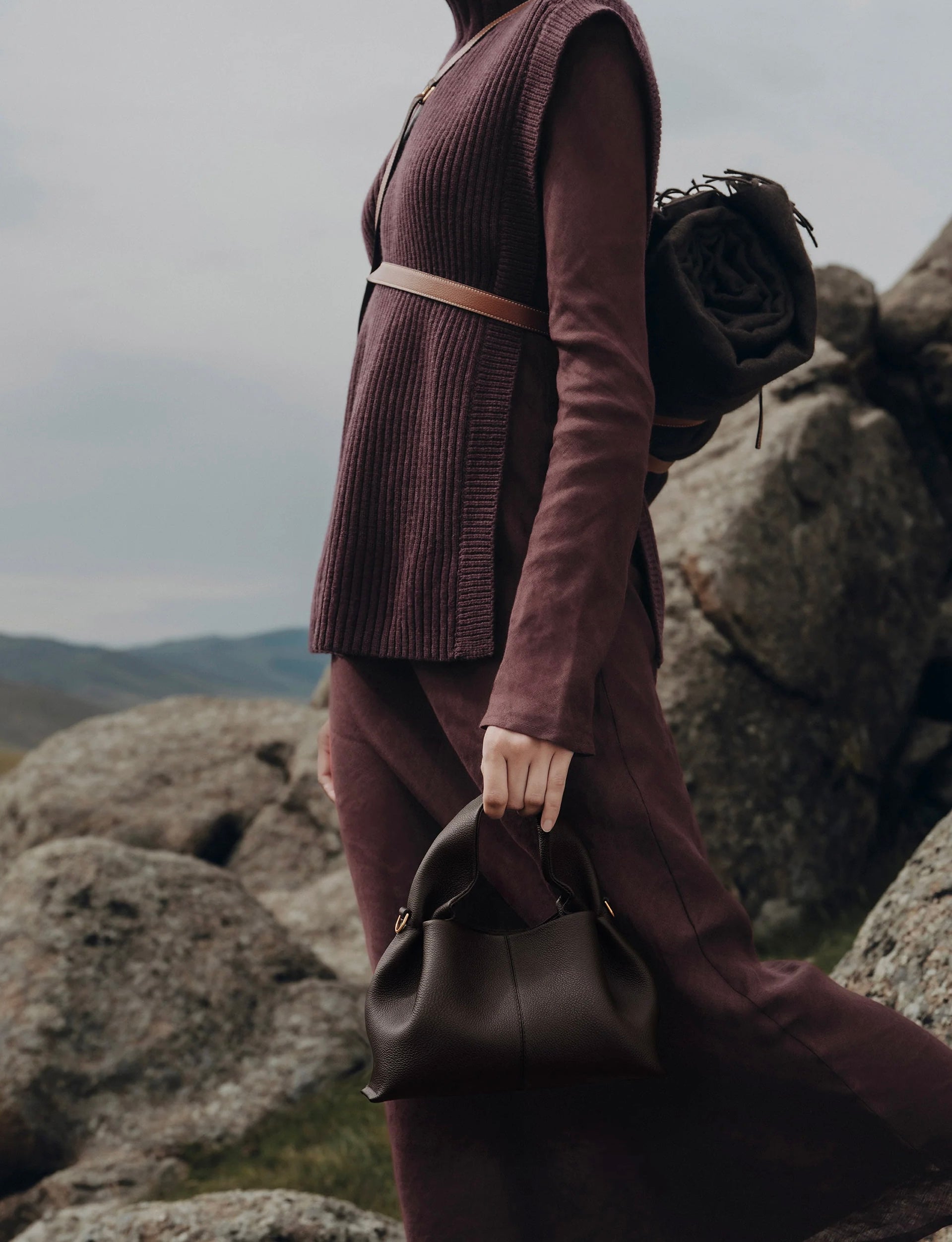 Moody Minimalist Outdoor Look Featuring Monochrome Plum Knit Layering and Tailored Trousers with Structured Espresso Brown Leather Top Handle Handbag – Sophisticated Quiet Luxury Womenswear Editorial Style