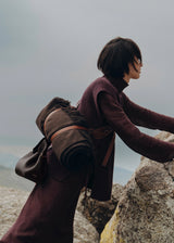 Moody Minimalist Outdoor Look Featuring Monochrome Plum Knit Layering and Tailored Trousers with Structured Espresso Brown Leather Top Handle Handbag – Sophisticated Quiet Luxury Womenswear Editorial Style