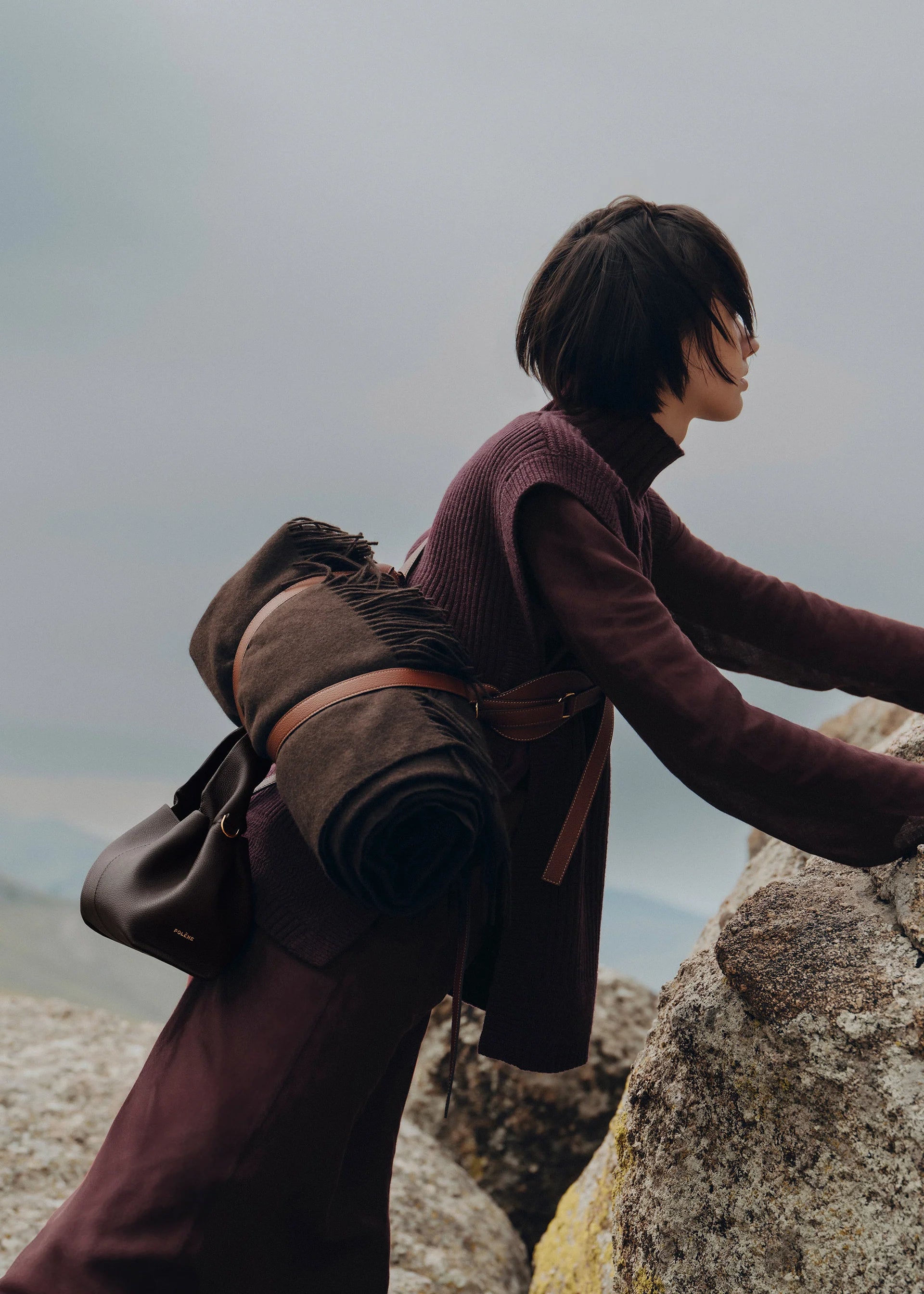 Moody Minimalist Outdoor Look Featuring Monochrome Plum Knit Layering and Tailored Trousers with Structured Espresso Brown Leather Top Handle Handbag – Sophisticated Quiet Luxury Womenswear Editorial Style