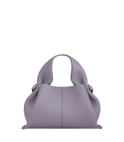 Elegant Minimalist Resort Look Featuring Flowing Ivory Tunic Dress and Draped Neutral Layers with Structured Soft Lilac Leather Top Handle Handbag – Modern Quiet Luxury Womenswear Editorial Style