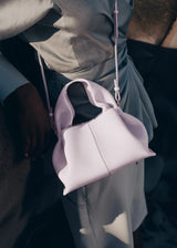Modern Minimalist Editorial Look Featuring Draped Sage Grey Tailoring with Structured Soft Lilac Leather Crossbody Top Handle Handbag – Elegant Quiet Luxury Womenswear Fashion Style