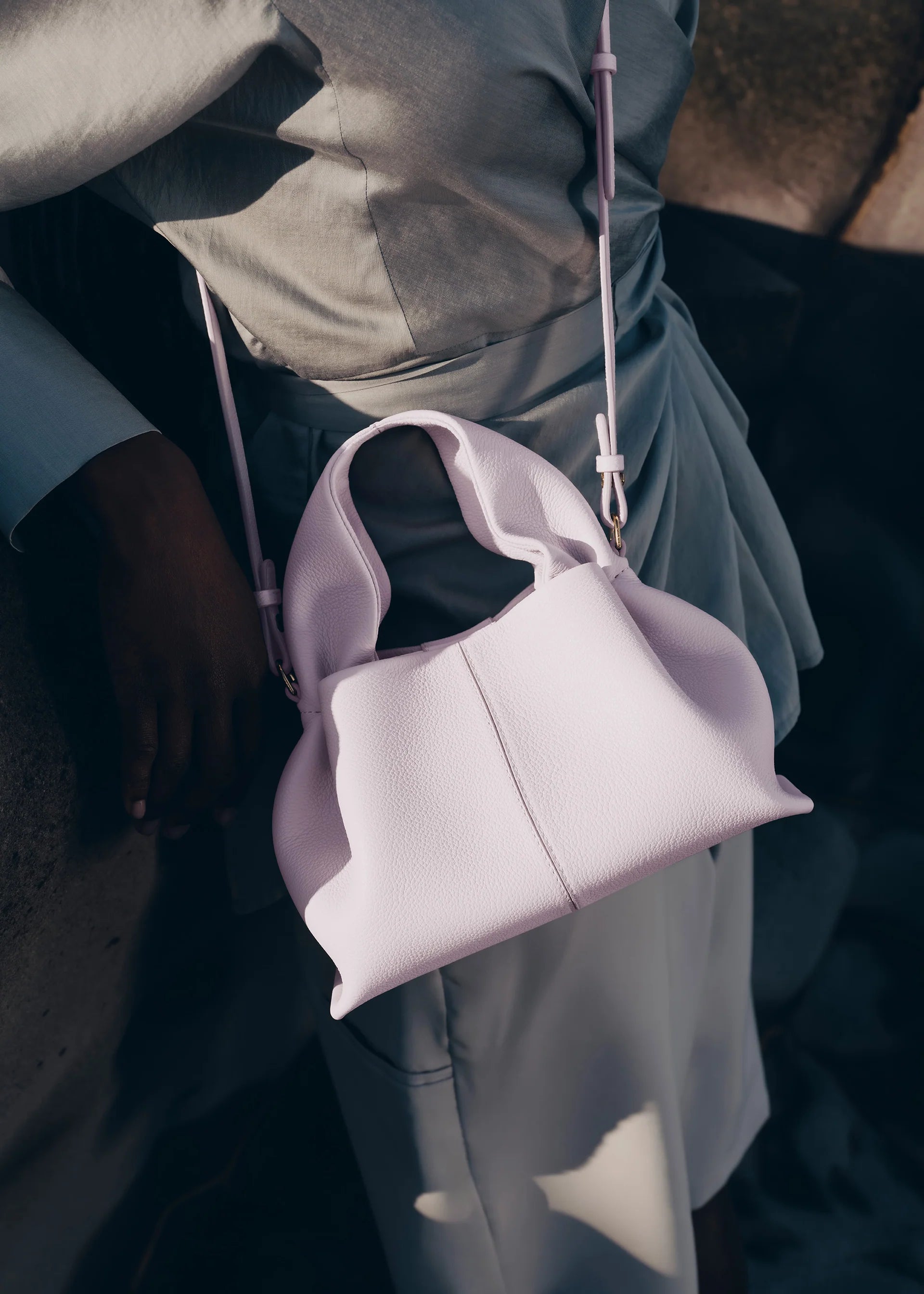 Modern Minimalist Editorial Look Featuring Draped Sage Grey Tailoring with Structured Soft Lilac Leather Crossbody Top Handle Handbag – Elegant Quiet Luxury Womenswear Fashion Style