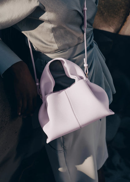 Modern Minimalist Editorial Look Featuring Draped Sage Grey Tailoring with Structured Soft Lilac Leather Crossbody Top Handle Handbag – Elegant Quiet Luxury Womenswear Fashion Style