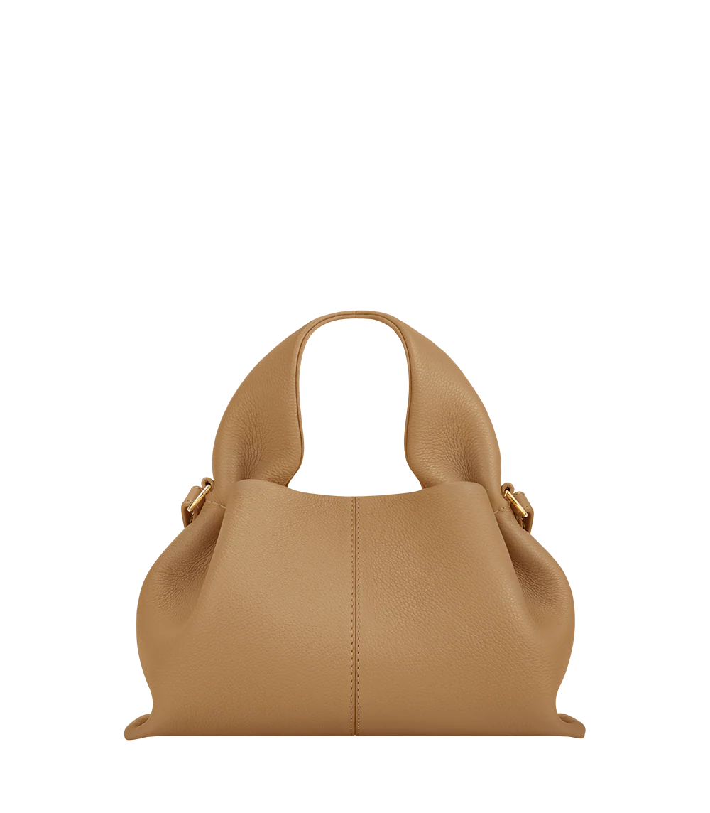 Sophisticated Minimalist Winter Look Featuring Oversized Black Wool Coat with Structured Camel Leather Crossbody Top Handle Handbag – Modern Quiet Luxury Womenswear Editorial Style