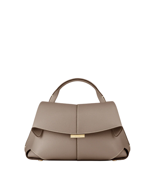 Taupe Leather Top-Handle Shoulder Bag Styled on Model in Neutral Sleeveless Dress