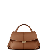 Elegant Tan Pebbled Leather Top-Handle Mini Handbag with Fold-Over Flap and Gold-Tone Hardware Styled with Neutral Knit Ensemble