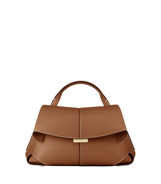 Elegant Tan Pebbled Leather Top-Handle Mini Handbag with Fold-Over Flap and Gold-Tone Hardware Styled with Neutral Knit Ensemble