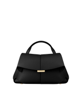 Elegant Black Pebbled Leather Top-Handle Shoulder Bag with Fold-Over Flap, Adjustable Strap, and Gold-Tone Hardware Styled in Minimalist Resort Look