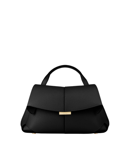 Elegant Black Pebbled Leather Top-Handle Shoulder Bag with Fold-Over Flap, Adjustable Strap, and Gold-Tone Hardware Styled in Minimalist Resort Look