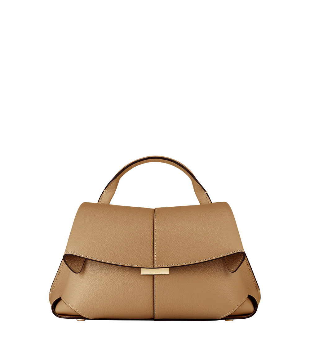Elegant Camel Pebbled Leather Top-Handle Handbag with Fold-Over Flap, Adjustable Strap, and Gold-Tone Hardware Styled in Luxe Winter Look