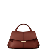 Elegant Cognac Pebbled Leather Top-Handle Shoulder Bag with Fold-Over Flap, Adjustable Strap, and Gold-Tone Hardware Styled in Modern Winter Look