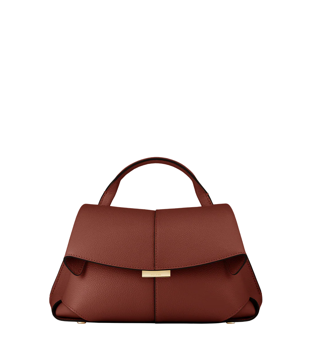 Elegant Cognac Pebbled Leather Top-Handle Shoulder Bag with Fold-Over Flap, Adjustable Strap, and Gold-Tone Hardware Styled in Modern Winter Look
