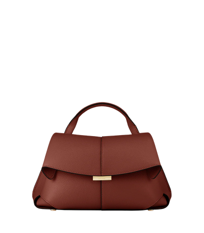 Elegant Cognac Pebbled Leather Top-Handle Shoulder Bag with Fold-Over Flap, Adjustable Strap, and Gold-Tone Hardware Styled in Modern Winter Look