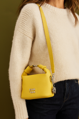 Trendy Yellow Soft-Texture Sling Bag with Metal Logo & Designer Charm Accent