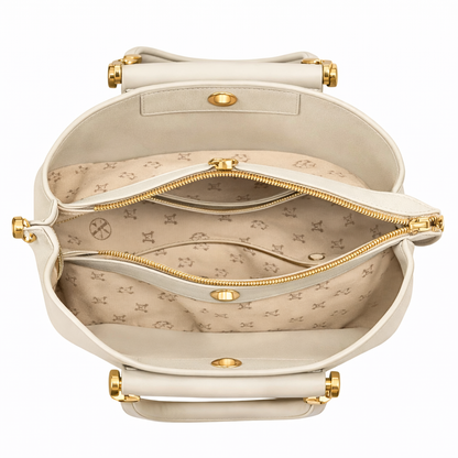 Smooth minimalist front panel enhanced with a structured flap detail and a detachable gold charm chain featuring pearl and mini handbag accents for a refined luxury-inspired finish.